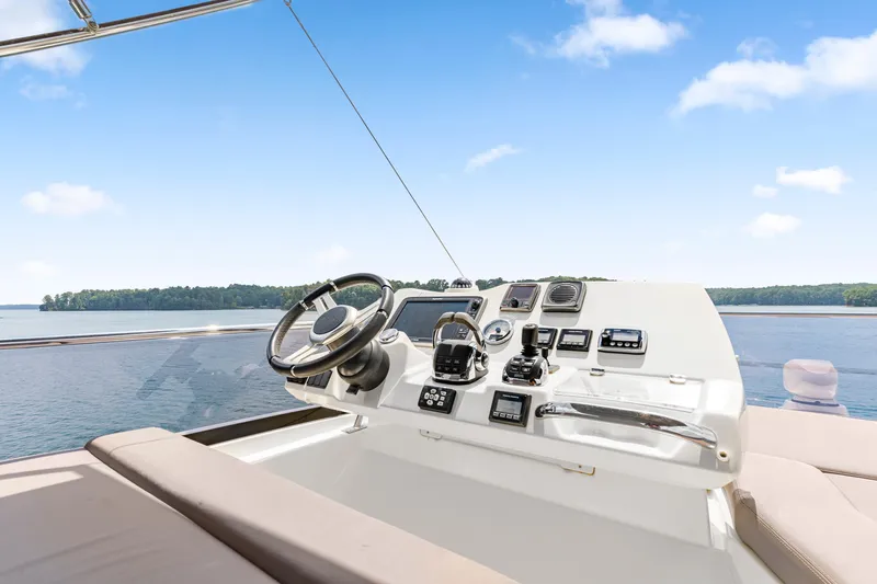  Yacht Photos Pics Helm of 2017 Prestige 500 yacht with scenic water view.