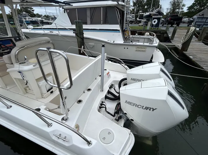  Yacht Photos Pics 2022 Boston Whaler 27 Dauntless with dual Mercury engines docked at marina.
