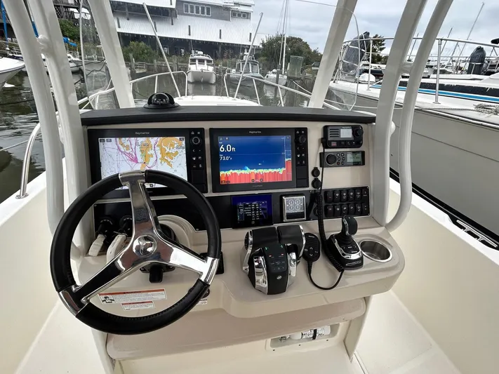  Yacht Photos Pics Cockpit of 2022 Boston Whaler 27 Dauntless with advanced navigation and control systems.