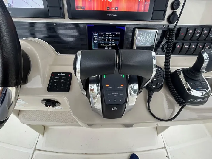  Yacht Photos Pics Control panel of 2022 Boston Whaler 27 Dauntless boat with throttle and joystick.