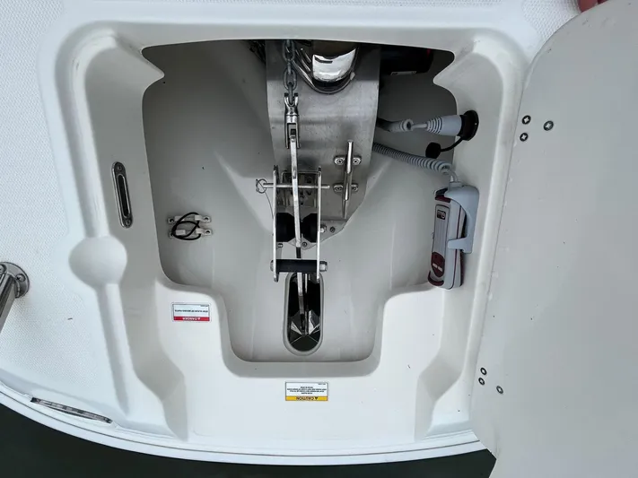  Yacht Photos Pics Anchor compartment of 2022 Boston Whaler 27 Dauntless boat, featuring storage and equipment.