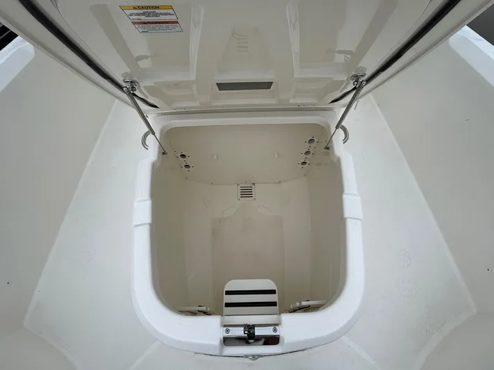  Yacht Photos Pics Open storage compartment on 2022 Boston Whaler 27 Dauntless boat.