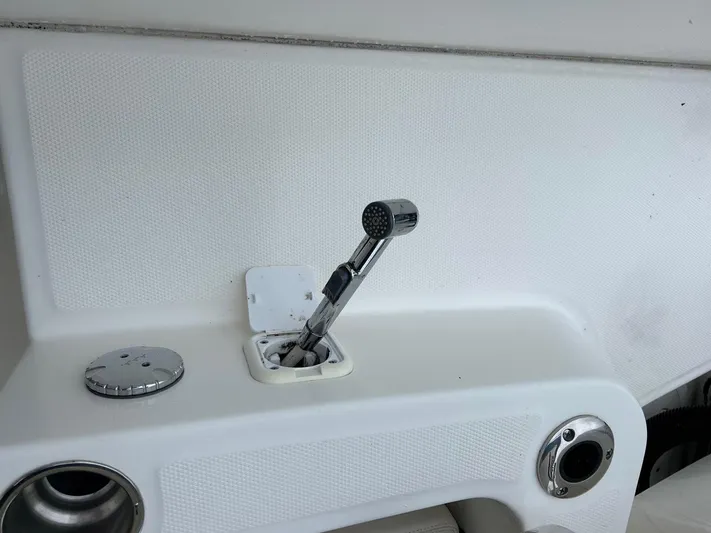  Yacht Photos Pics 2022 Boston Whaler 27 Dauntless boat interior with chrome shower head detail.