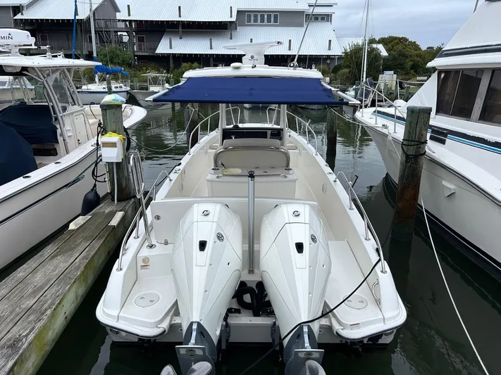  Yacht Photos Pics 2022 Boston Whaler 27 Dauntless boat docked at marina with twin engines.