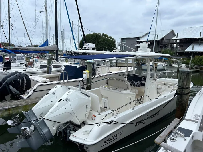  Yacht Photos Pics 2022 Boston Whaler 27 Dauntless boat docked at marina with twin engines.