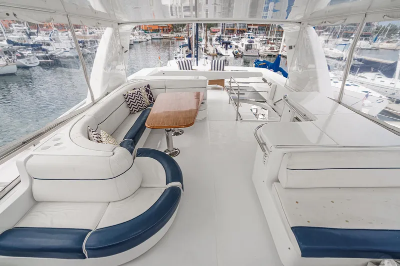 Dancing Lady Yacht Photos Pics Luxurious 1999 Horizon 70 Motor Yacht interior with elegant seating and marina view.