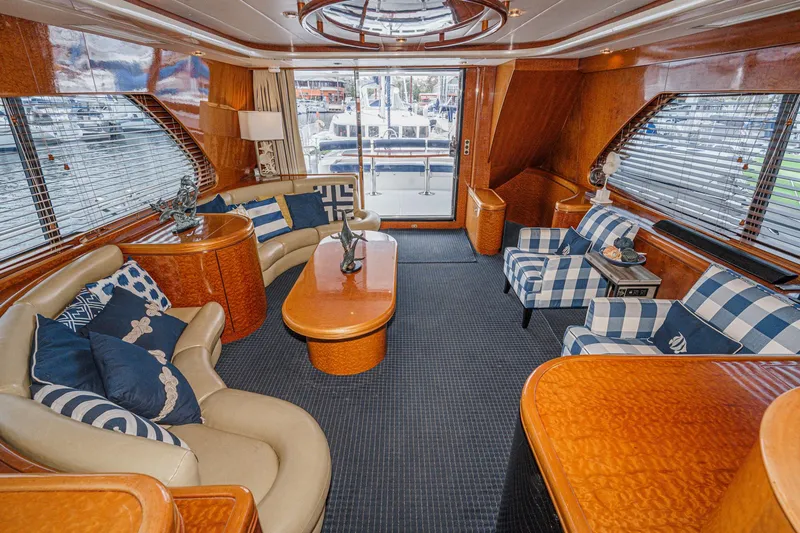 Dancing Lady Yacht Photos Pics Luxurious interior of a 1999 Horizon 70 Motor Yacht with elegant seating and decor.