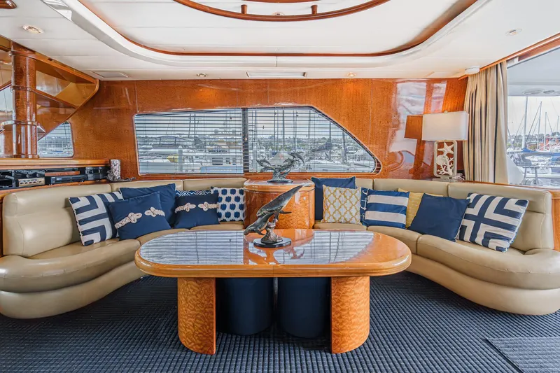 Dancing Lady Yacht Photos Pics Luxurious interior of a 1999 Horizon 70 Motor Yacht with elegant seating and nautical decor.