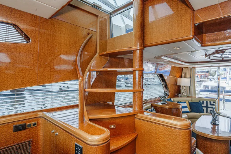Dancing Lady Yacht Photos Pics Luxurious interior of a 1999 Horizon 70 Motor Yacht with elegant wood finishes.