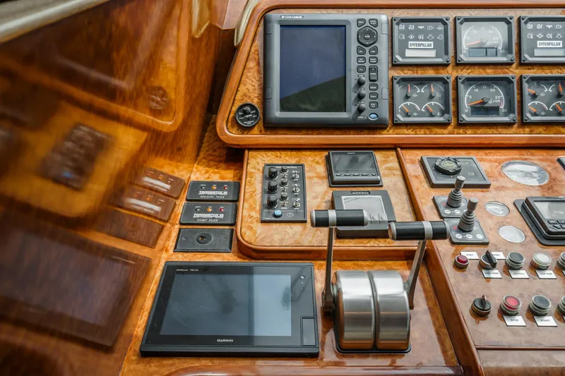 Dancing Lady Yacht Photos Pics Control panel of a 1999 Horizon 70 Motor Yacht with navigation and monitoring instruments.