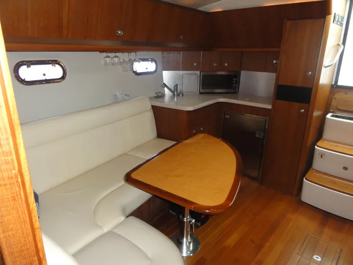  Yacht Photos Pics Interior of 2006 Tiara Yachts 3600 Sovran with wood finish and white seating.
