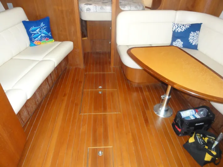  Yacht Photos Pics 2006 Tiara Yachts 3600 Sovran interior with wooden flooring and white seating.