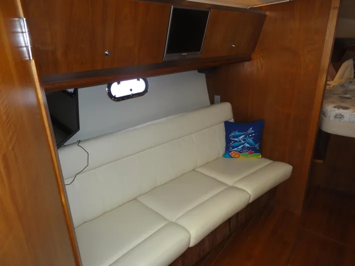  Yacht Photos Pics Interior of 2006 Tiara Yachts 3600 Sovran with white sofa and marine-themed pillow.