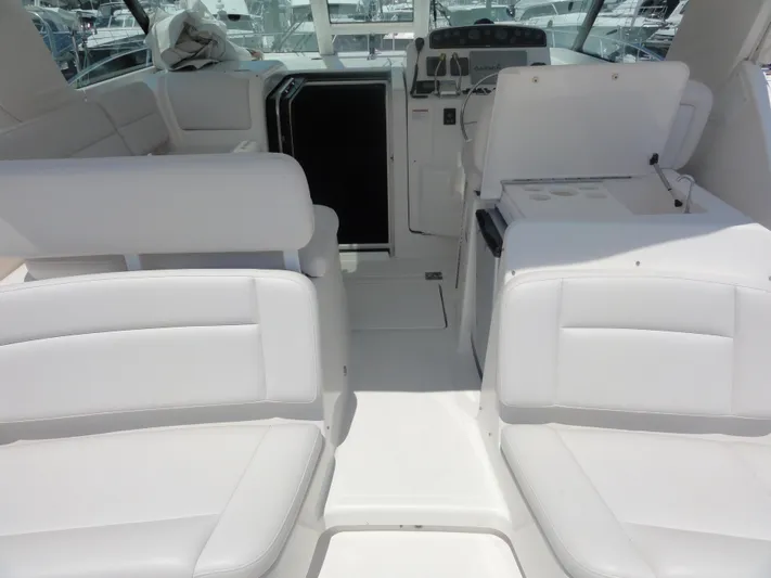  Yacht Photos Pics 2006 Tiara Yachts 3600 Sovran interior with white seating and helm station.