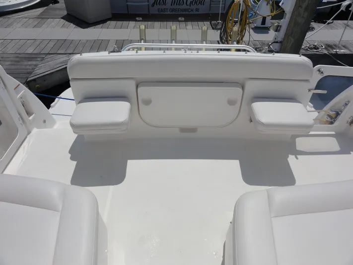  Yacht Photos Pics 2006 Tiara Yachts 3600 Sovran cockpit with white cushioned seating and clean deck.
