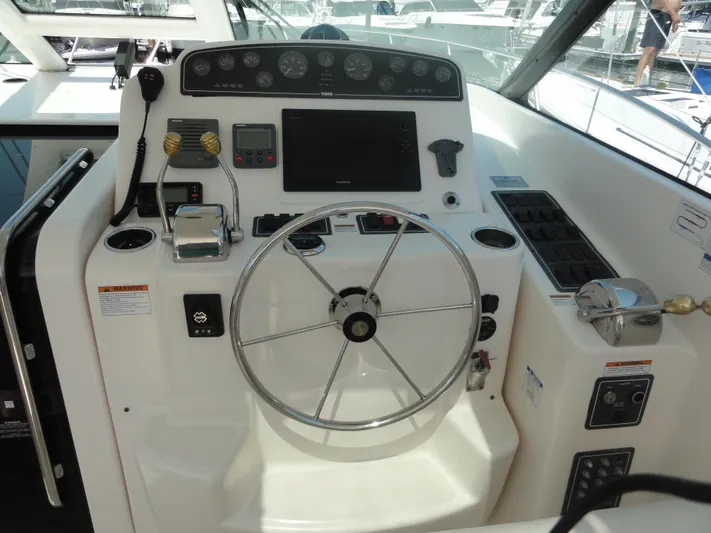  Yacht Photos Pics Helm of 2006 Tiara Yachts 3600 Sovran with steering wheel and control panel.