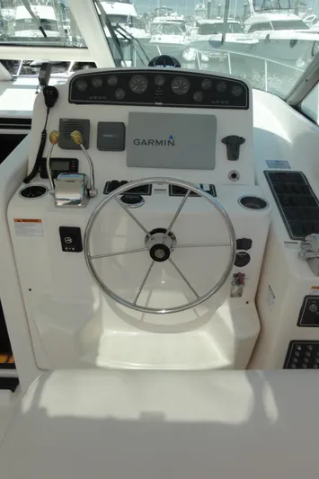  Yacht Photos Pics 2006 Tiara Yachts 3600 Sovran helm with Garmin navigation system and steering wheel.