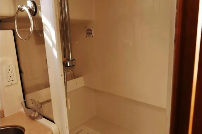 Dragonfly Yacht Photos Pics Shower area in 2007 Back Cove 33 boat, featuring a compact design and modern fixtures.