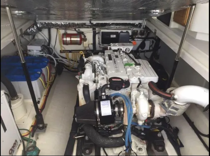 Dragonfly Yacht Photos Pics Engine room of a 2007 Back Cove 33 boat, showcasing the engine and wiring.