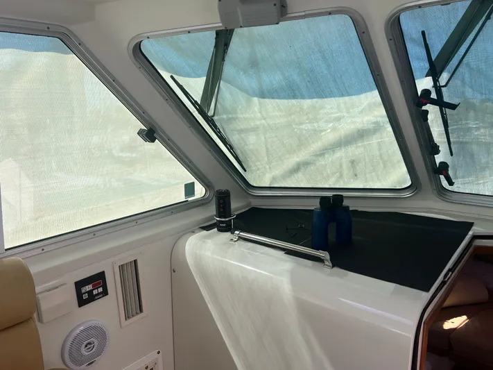 Dragonfly Yacht Photos Pics Interior view of 2007 Back Cove 33 boat with windows and navigation equipment.