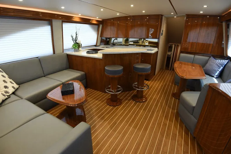 Lena Maria Yacht Photos Pics Luxurious interior of 2020 Viking 58 Convertible yacht with elegant seating and modern kitchen.
