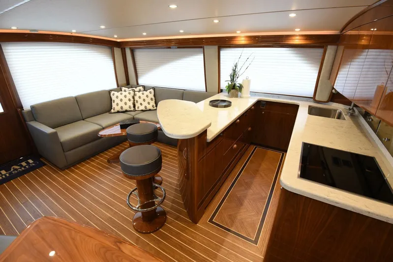 Lena Maria Yacht Photos Pics Luxurious interior of 2020 Viking 58 Convertible yacht with modern kitchen and seating area.