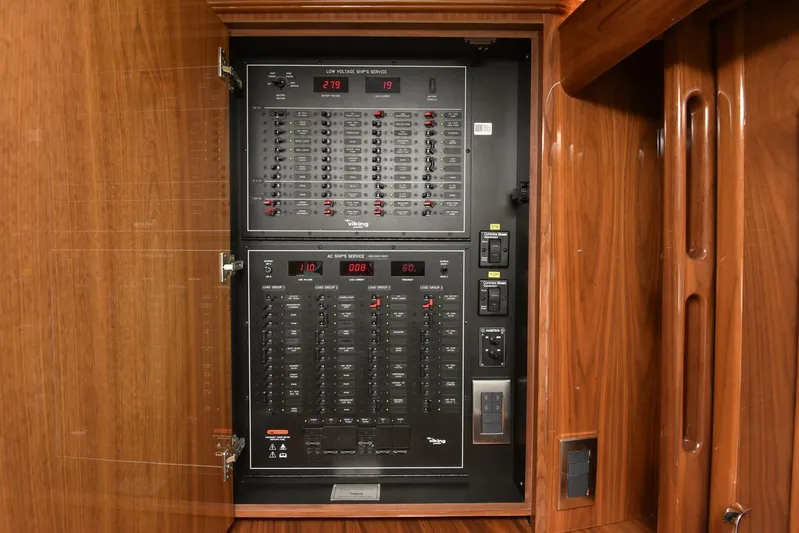 Lena Maria Yacht Photos Pics Electrical panel inside 2020 Viking 58 Convertible yacht, featuring switches and digital displays.
