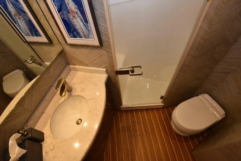Lena Maria Yacht Photos Pics Luxurious bathroom in 2020 Viking 58 Convertible yacht with modern fixtures and elegant design.