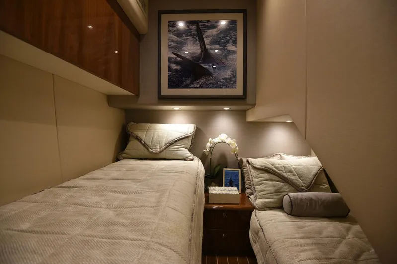 Lena Maria Yacht Photos Pics Luxurious cabin interior of 2020 Viking 58 Convertible yacht with twin beds and elegant decor.