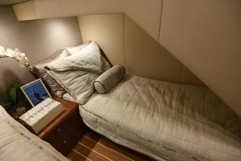 Lena Maria Yacht Photos Pics Luxurious cabin interior of 2020 Viking 58 Convertible yacht with cozy bedding and elegant decor.