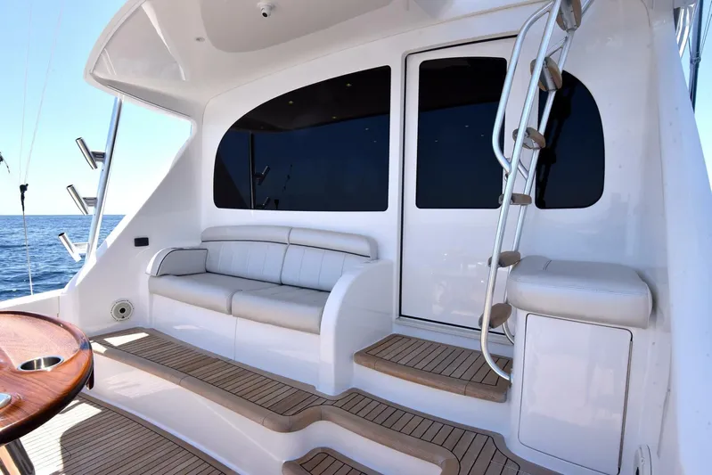 Lena Maria Yacht Photos Pics 2020 Viking 58 Convertible yacht deck with seating and ocean view.