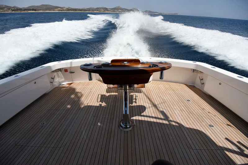 Lena Maria Yacht Photos Pics 2020 Viking 58 Convertible yacht cruising, view from deck with ocean wake.