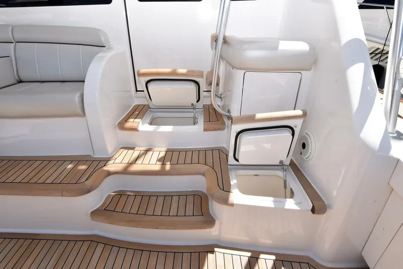 Lena Maria Yacht Photos Pics 2020 Viking 58 Convertible yacht interior with teak steps and seating area.