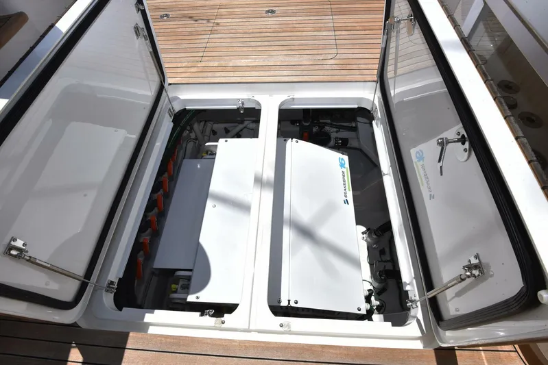 Lena Maria Yacht Photos Pics Engine compartment of 2020 Viking 58 Convertible yacht, showcasing advanced machinery and storage.