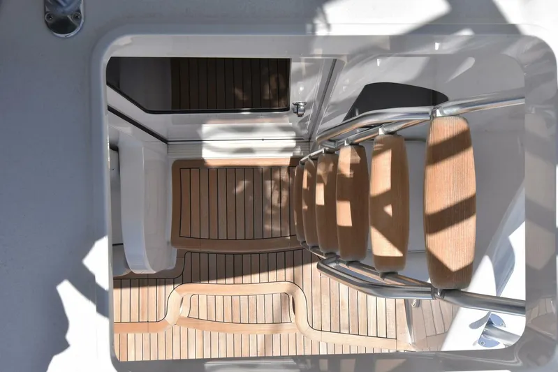 Lena Maria Yacht Photos Pics Staircase on 2020 Viking 58 Convertible yacht with wooden steps and sleek design.