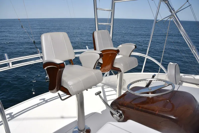 Lena Maria Yacht Photos Pics Luxury seating on 2020 Viking 58 Convertible yacht, overlooking ocean.