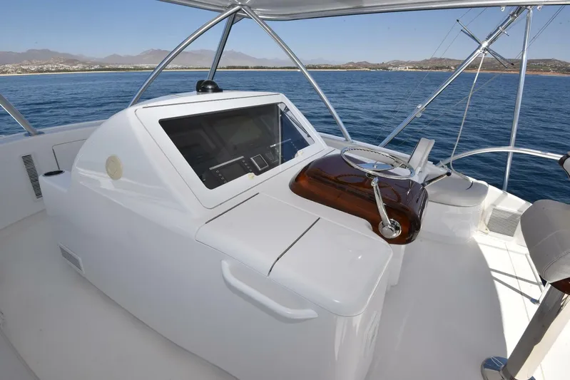 Lena Maria Yacht Photos Pics 2020 Viking 58 Convertible yacht helm with ocean view and navigation equipment.