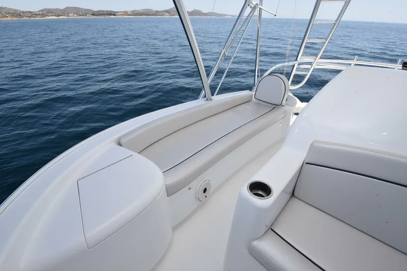 Lena Maria Yacht Photos Pics 2020 Viking 58 Convertible yacht deck with seating, ocean view, and sleek design.