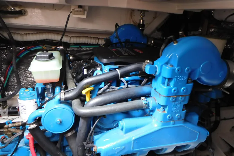  Yacht Photos Pics Engine compartment of a 2006 Tiara Yachts 3600 Sovran, showcasing blue machinery and components.