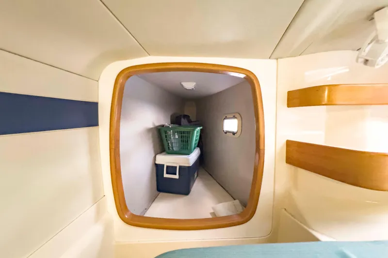 &Eacute;toile De Mer Yacht Photos Pics Interior storage space on a 2002 Leopard 42 yacht with cooler and basket.