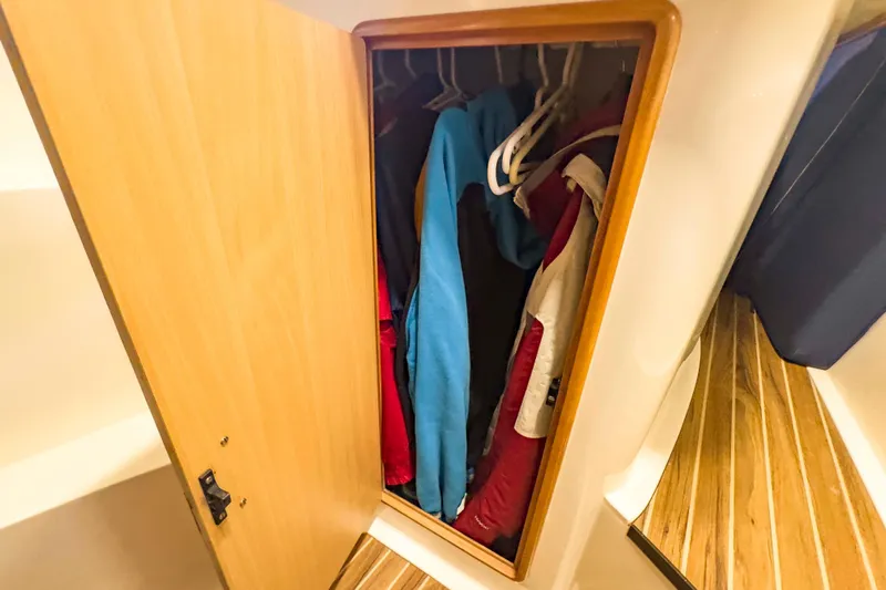 &Eacute;toile De Mer Yacht Photos Pics Wooden closet with hanging jackets inside a 2002 Leopard 42 yacht.