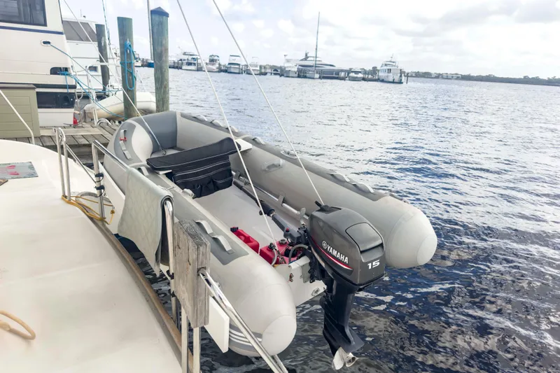 &Eacute;toile De Mer Yacht Photos Pics Inflatable boat with Yamaha 15 motor docked beside Leopard 42 yacht, 2002 model.