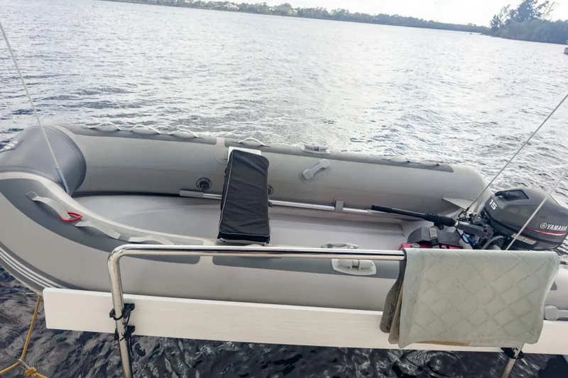 &Eacute;toile De Mer Yacht Photos Pics Inflatable boat with Yamaha motor on water, near Leopard 42 catamaran, 2002 model.