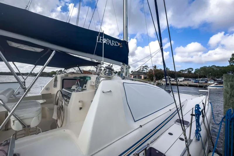 &Eacute;toile De Mer Yacht Photos Pics Sailing yacht Leopard 42, 2002 model, docked at marina under blue sky.
