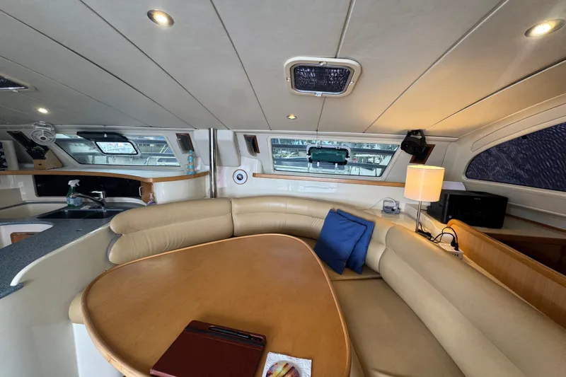 &Eacute;toile De Mer Yacht Photos Pics Luxurious interior of a 2002 Leopard 42 yacht with cozy seating and modern amenities.