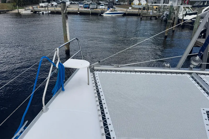 &Eacute;toile De Mer Yacht Photos Pics Bow of a 2002 Leopard 42 catamaran docked at a marina.