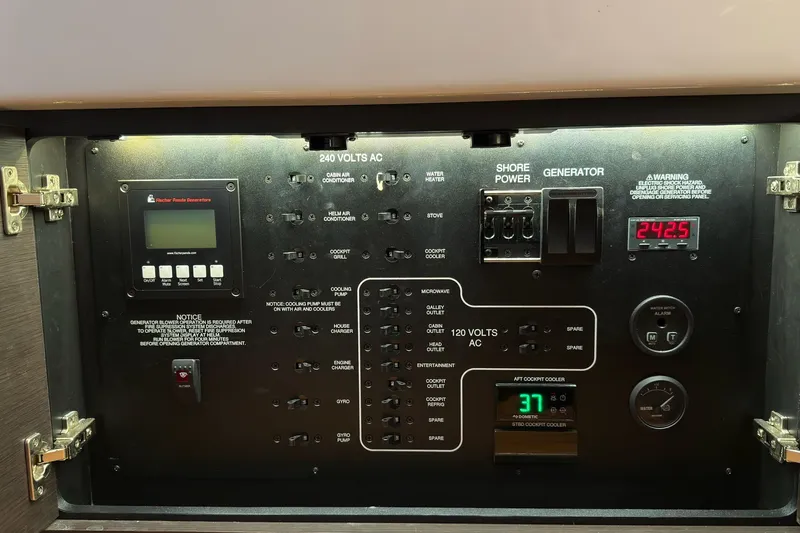  Yacht Photos Pics Electrical control panel of a 2019 Pursuit S 408 Sport boat, featuring various switches and meters.