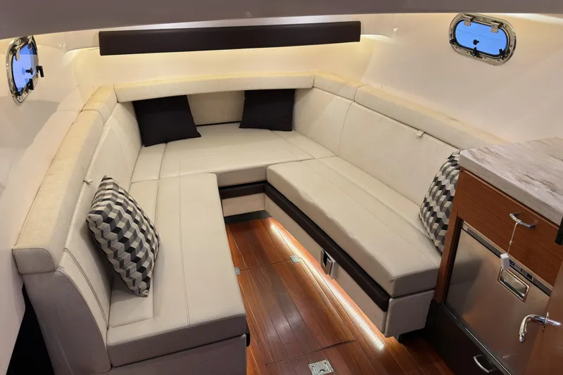  Yacht Photos Pics Luxurious interior of 2019 Pursuit S 408 Sport boat with elegant seating and modern design.
