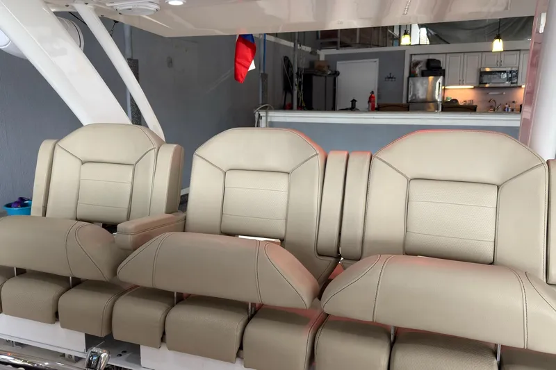  Yacht Photos Pics 2019 Pursuit S 408 Sport boat seats in a modern interior setting.