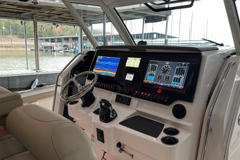  Yacht Photos Pics 2019 Pursuit S 408 Sport boat dashboard with advanced navigation and control systems.